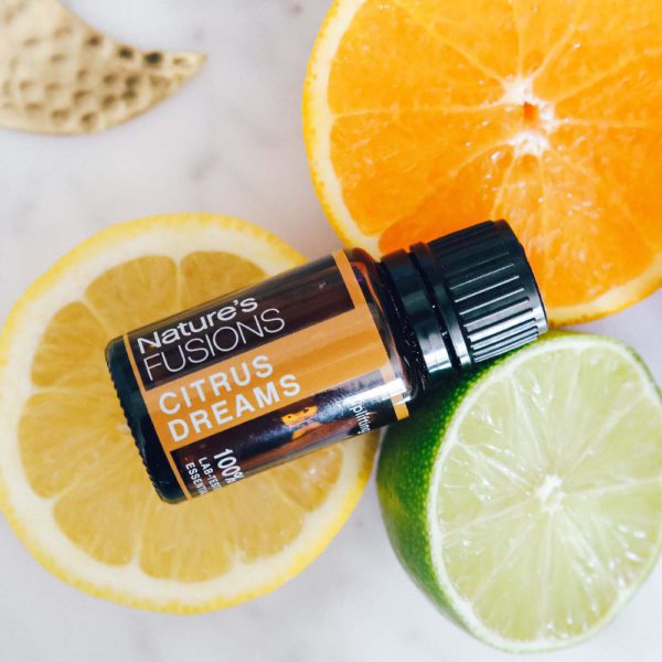 Citrus Dreams essential oil blend with citrus fruits photo