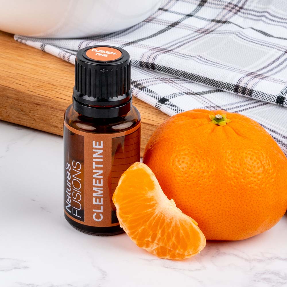 Nature's Fusions clementine essential oil with fruit place setting