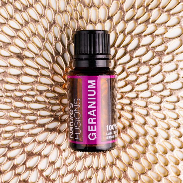 Nature's Fusions geranium essential oil on metallic flower plate