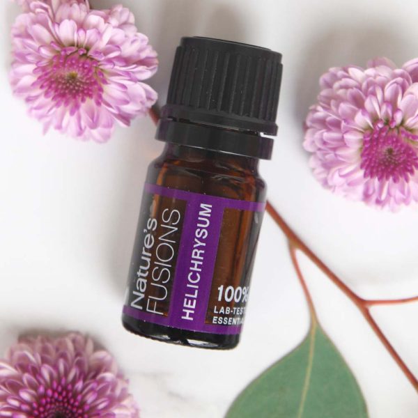 Nature's Fusions helichrysum essential oil with purple flowers