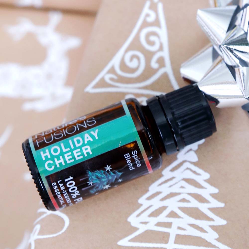 Holiday Cheer essential oil blend with wrapping paper