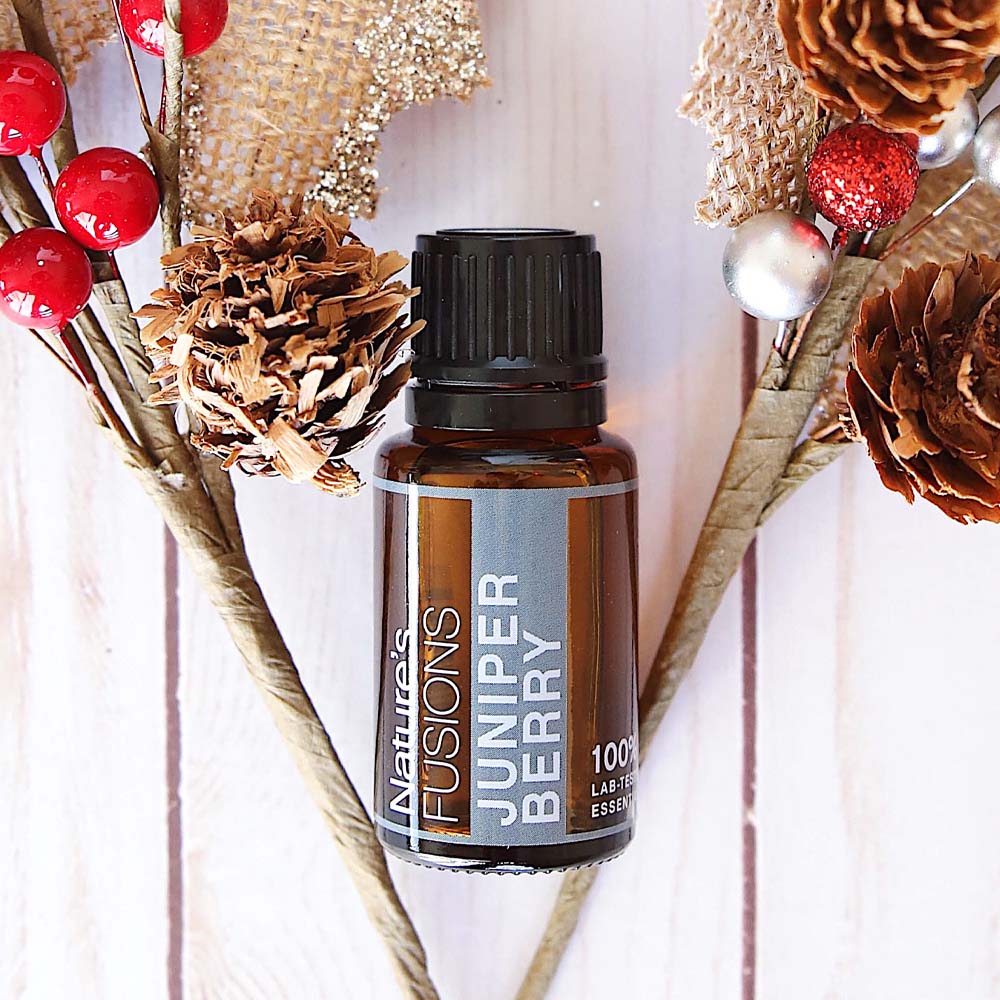 juniper berry essential oil with decorations photo