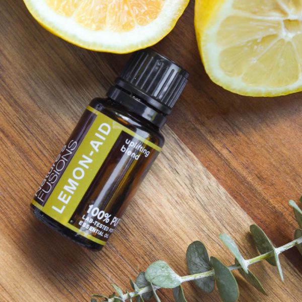 uplifting Lemon-Aid essential oil blend photo with lemons