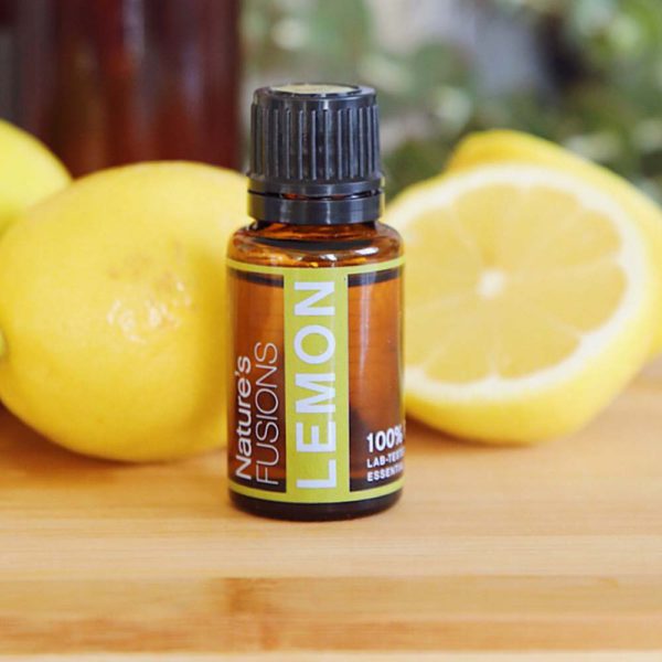 lemon oil on counter with lemons 100% pure lab tested