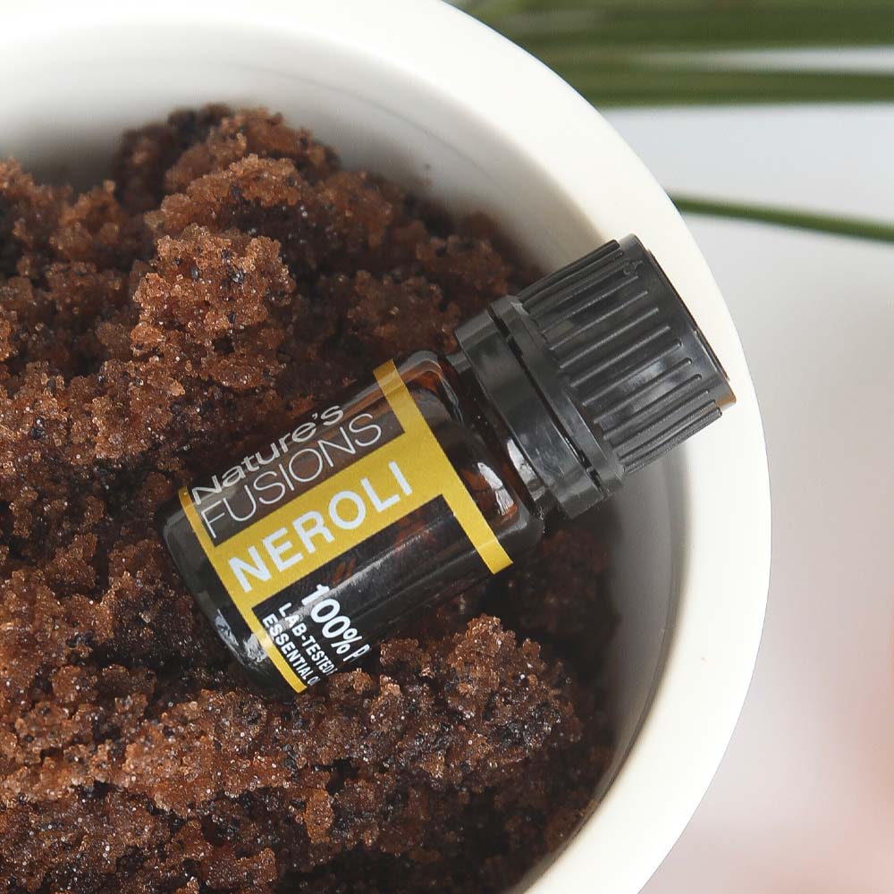 neroli oil in bowl of brown sugar crystals
