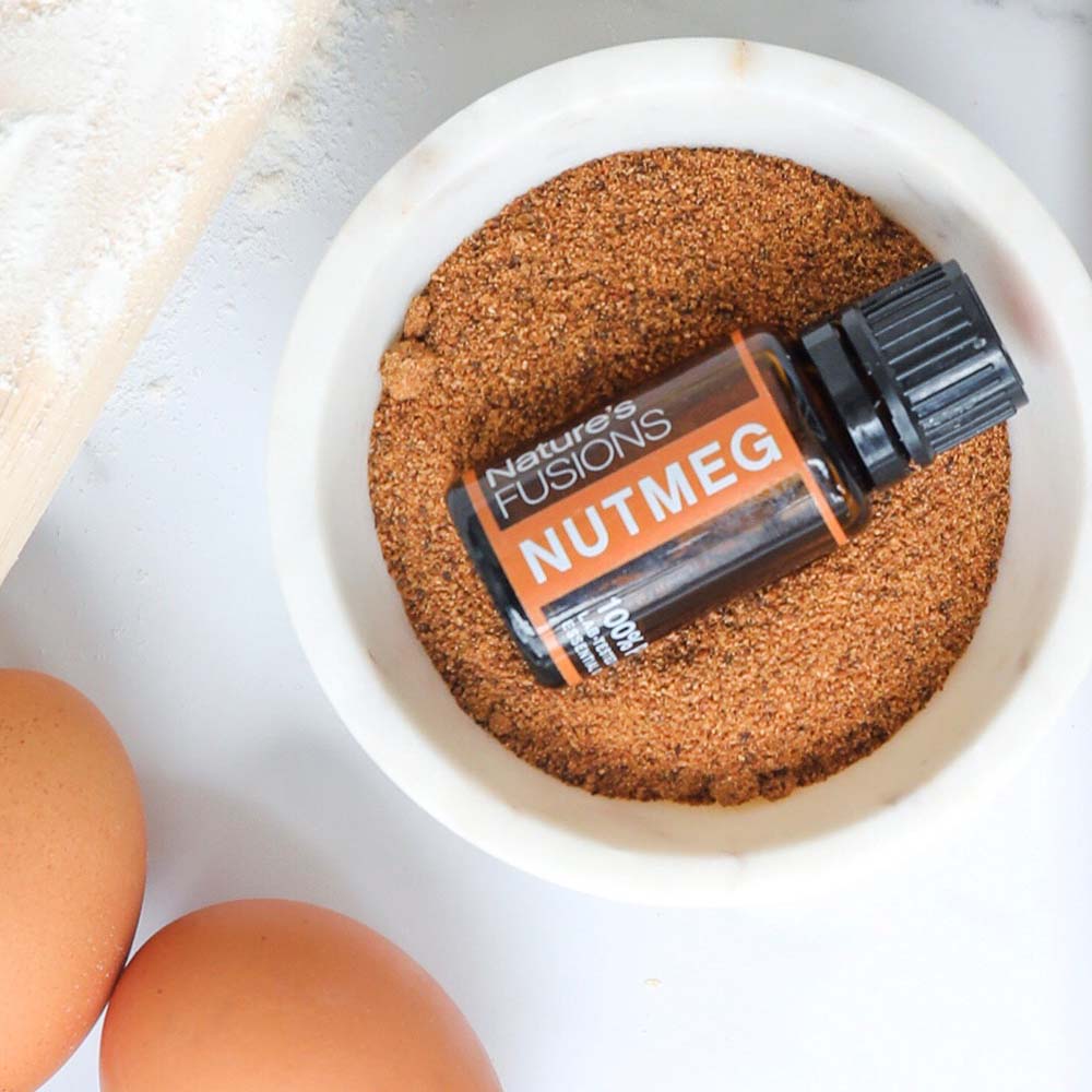 nutmeg essential oil photo with baking ingredients