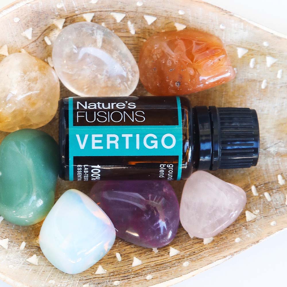 Vertigo essential oil bottle with polished stones