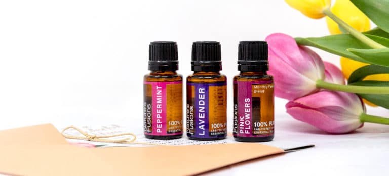 the three essential oils with flowers and handwritten card