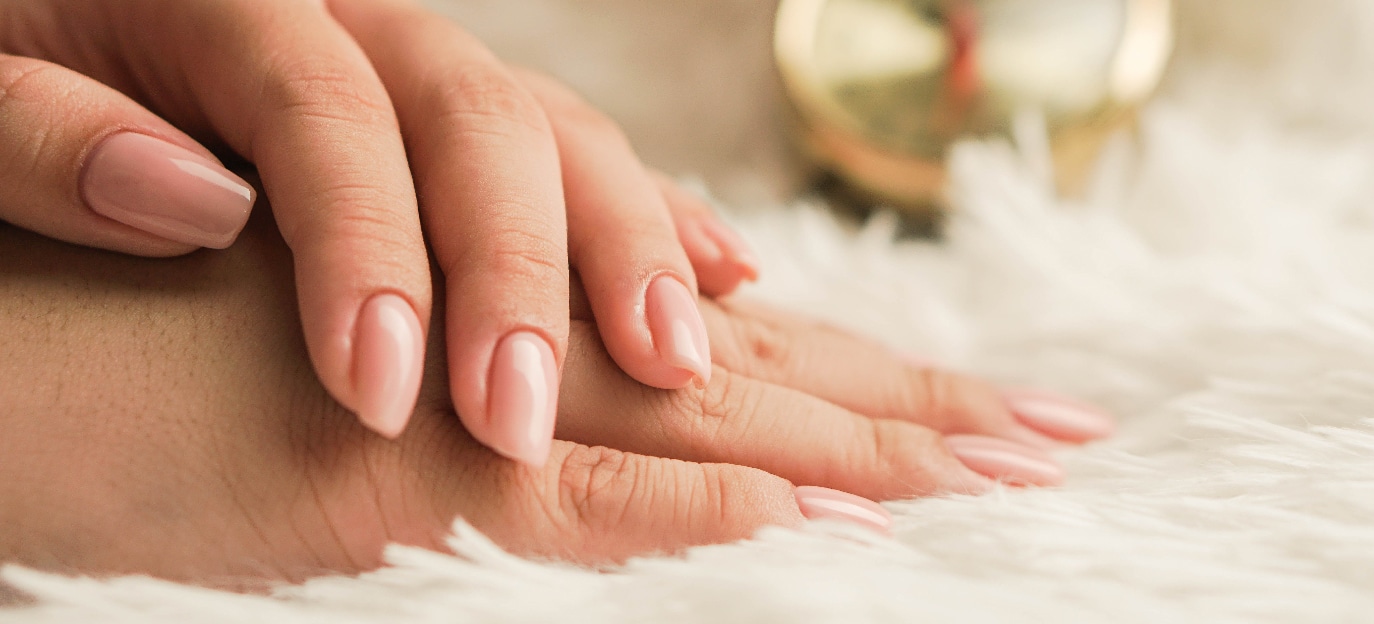 woman's hands on soft surface