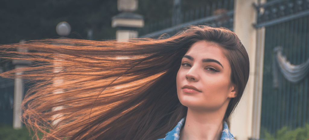 woman with hair blowing outside