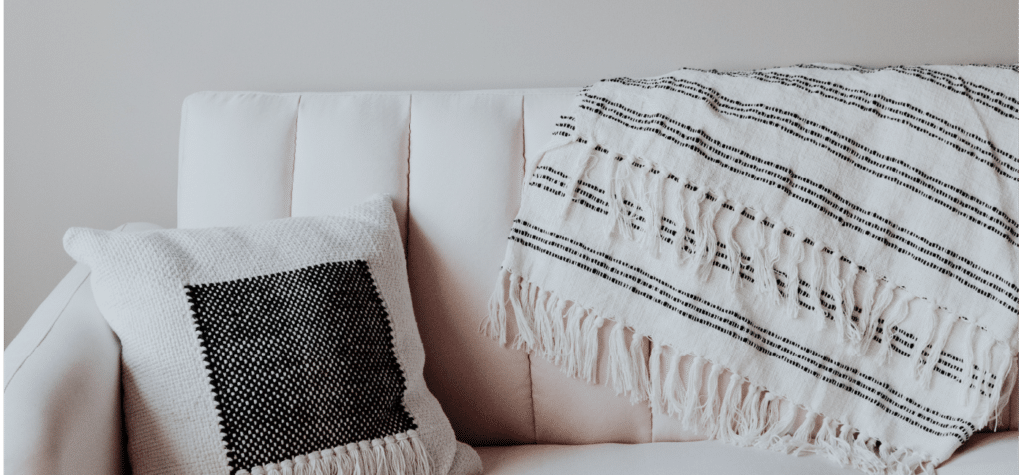 blanket draped over sofa