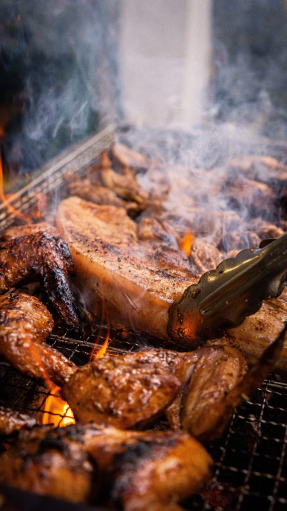 barbequing chicken and pork