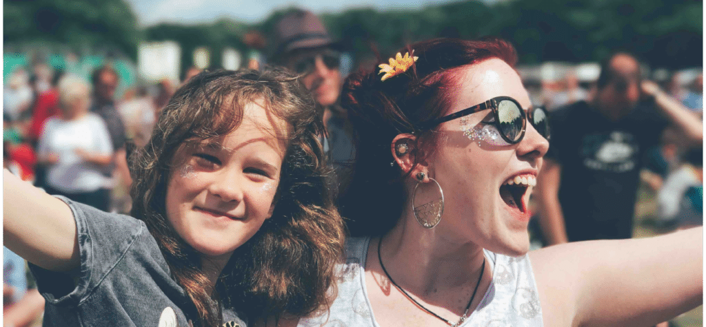 woman and girl smiling at festival