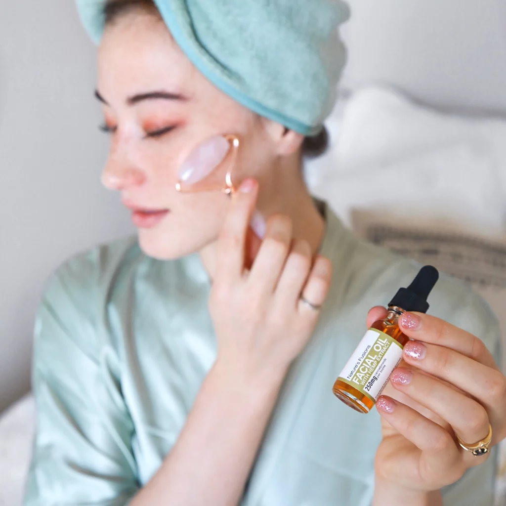 woman using Facial Oil with Hemp Extract