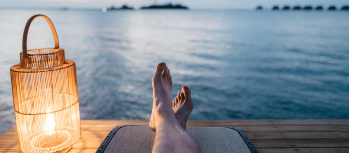 relaxing on pier with lantern